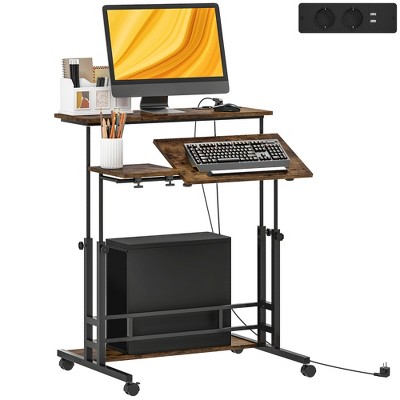 HOMCOM Standing Desk with Power Outlets, Height Adjustable Stand Up Desk with Tiltable Tabletop, Lockable Wheels, Shelf, for Home Office, Brown