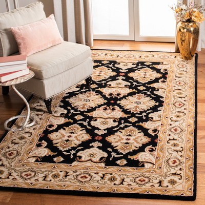 Hand-Tufted Black and Ivory Wool Oval Area Rug