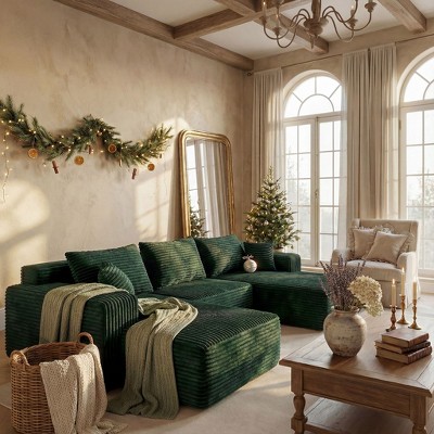 Green sectional sofa with holiday decor and Christmas tree