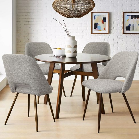 Upholstered dining deals chairs walnut legs