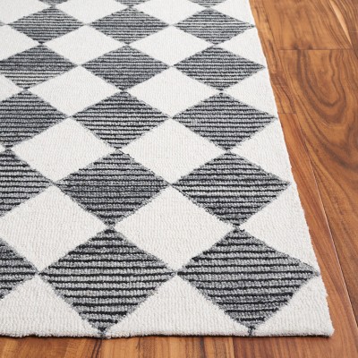 Ebony EBN120 Handmade Tufted Rug - Safavieh