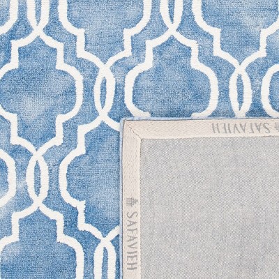 Blue and Ivory Tufted Wool 4' x 6' Area Rug