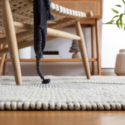 Handwoven Black and Ivory Wool 6' x 9' Area Rug