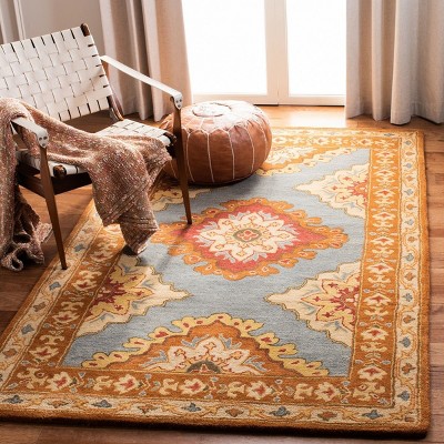 Hand-Tufted Blue and Rust Wool 5' x 8' Area Rug