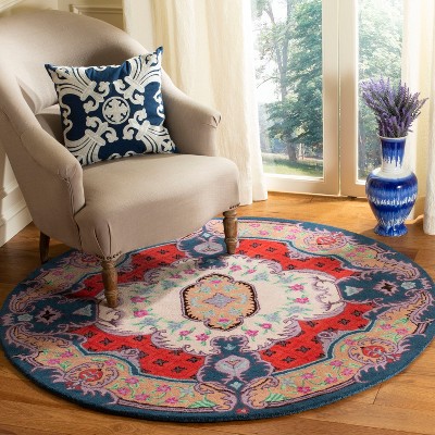 Handmade Round Ivory and Pink Wool Viscose Area Rug