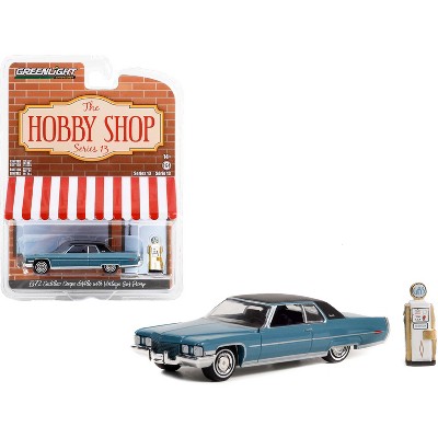 1972 Cadillac Coupe DeVille Blue with Black Top and Vintage Gas Pump The  Hobby Shop 1/64 Diecast Model Car by Greenlight