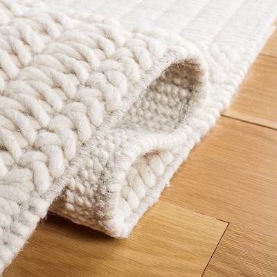 Ivory Handmade Wool Tufted 6' x 9' Area Rug