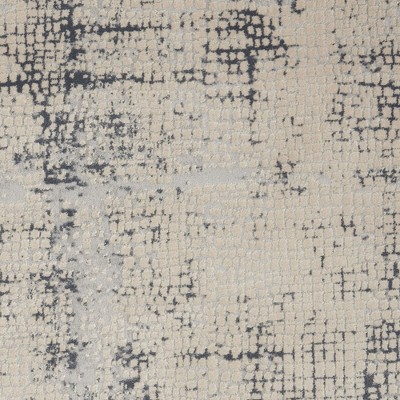Ivory and Blue Abstract Synthetic 9x13 Area Rug