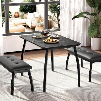 Dining table with two benches in a living room