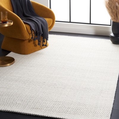 Ivory Handwoven Wool and Synthetic 4' x 6' Area Rug