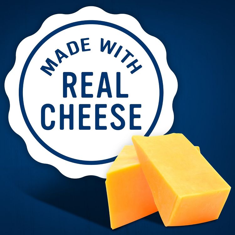 Two blocks of orange colored cheese are placed in front of a circular label reading "MADE WITH REAL CHEESE" on a blue background.
