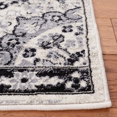 Ivory and Black Synthetic Rectangular 8' x 10' Area Rug