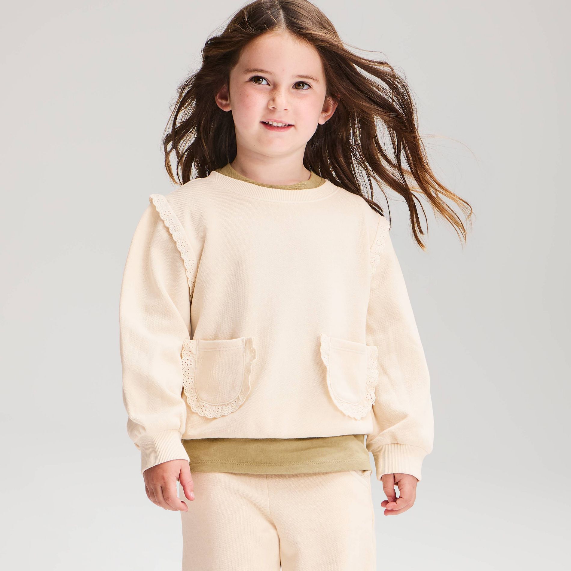 Toddler Girls' French Terry Ruffle Pockets Crewneck Sweatshirt - Cat & Jack™ Cream 4T