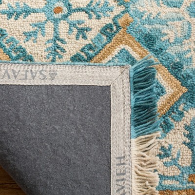 Handmade Ivory and Teal Wool Rectangular Area Rug, 5' x 8'