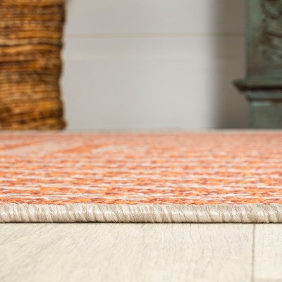 4' x 6' Ivory and Orange Geometric Synthetic Area Rug