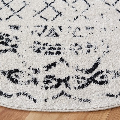 Ivory and Black Boho-Chic Synthetic 3' Round Area Rug