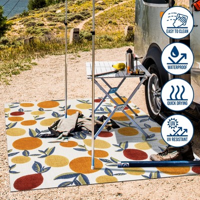 4' x 6' Ivory and Orange Floral Synthetic Area Rug