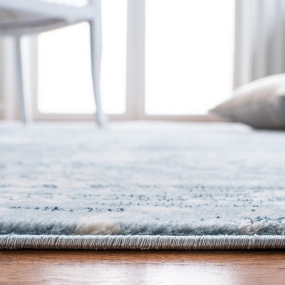 Denim Blue and Ivory Synthetic Round Area Rug