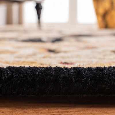 Hand-Tufted Black and Ivory Wool Oval Area Rug