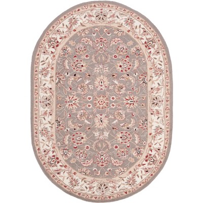 Handmade Taupe and Ivory Oval Wool Area Rug 4' x 6'