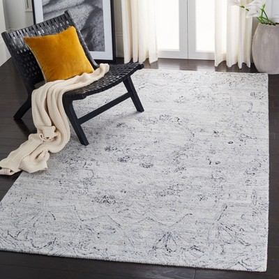 Handmade Black and Ivory Abstract Wool Rug