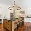 PAKOKULA Farmhouse 16 light Black Wagon Wheel Rustic Chandelier with Clear Glass Shade & Rattan Accents for Dinning Room - 2 of 4