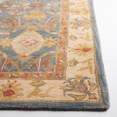 Handmade Light Blue and Ivory Floral Wool 6' x 9' Area Rug