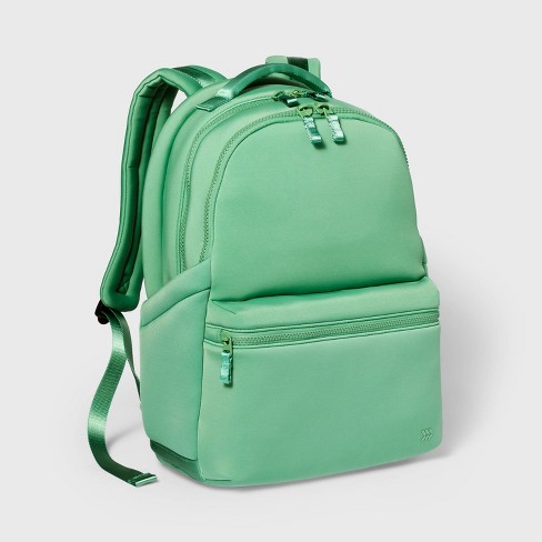 Green fashion and blue backpack