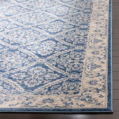 Navy and Cream Synthetic Bohemian Area Rug with Border Embellishment