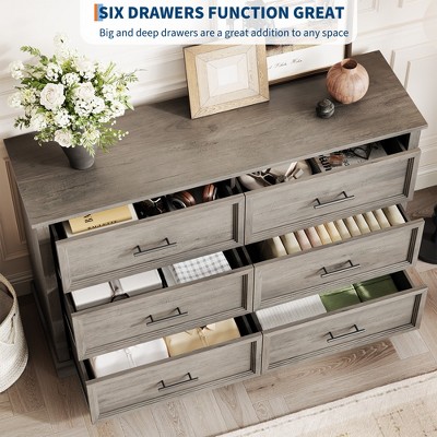 Open drawers showing organization of six-drawer dresser