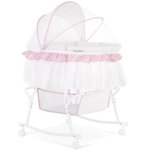 Pink and store white bassinet