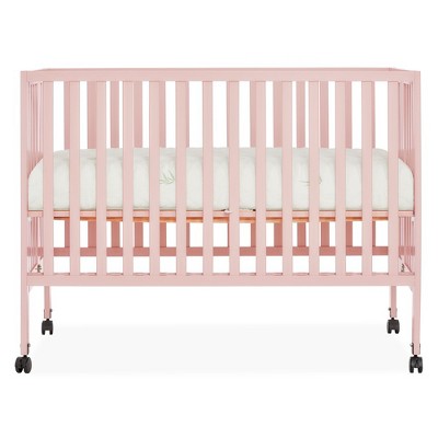 Image of Dream On Me Quinn Full-Size Folding Crib I Removable Wheels I Modern Nursey I Adjustable Mattress Support I Patent Folding System in Blush Pink