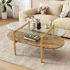 MAYEERTY Oval Glass Coffee Table, 2 Tier Structure Clear Glass Top and Walnut Finish Wood Shelf Conical Legs with Gold Finish Frame - 2 of 4