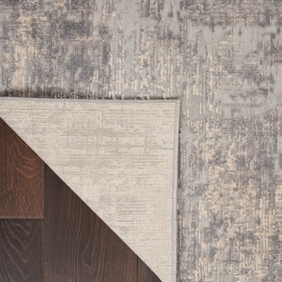 Ivory Abstract Power-Loomed Synthetic 5'3" x 7'3" Area Rug