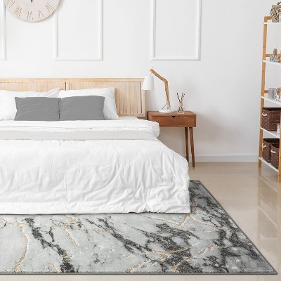 Ivory 5' x 7' Abstract Stain-Resistant Synthetic Area Rug