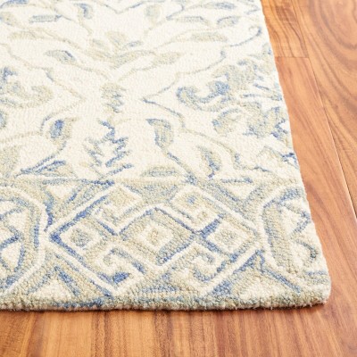 Handmade Light Blue and Ivory Wool Tufted Area Rug