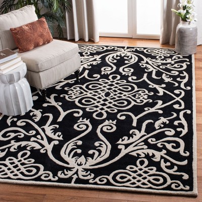 Handmade Black and Ivory Wool Viscose Tufted Area Rug
