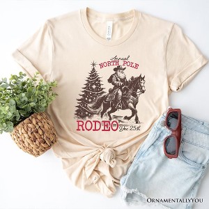 Annual North Pole Rodeo T-Shirt, Funny Cowboy Santa Christmas Tee for Country Lovers| OrnamentallyYou - 1 of 4