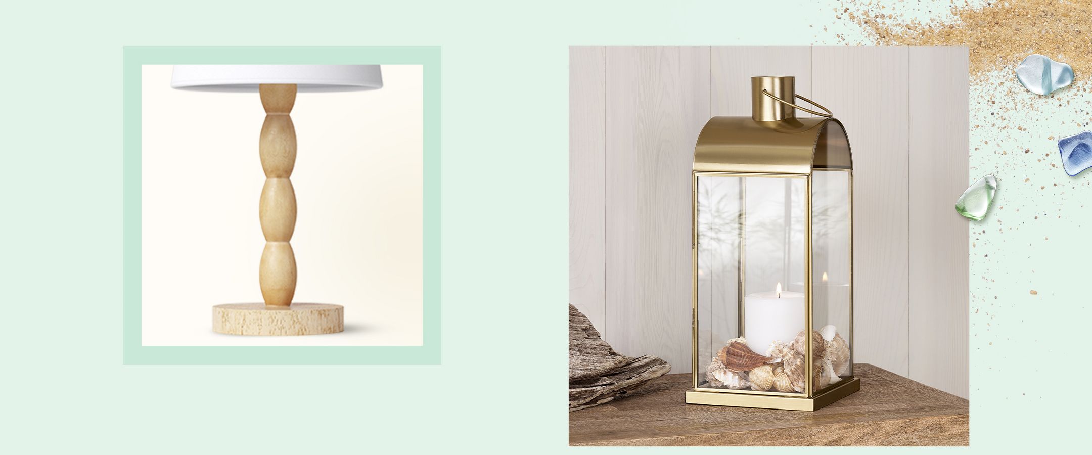 A gold-colored lantern with a white candle inside, surrounded by seashells, sits on a wood-finish table. Beside it is a piece of driftwood. The background is a light wood-paneled wall.