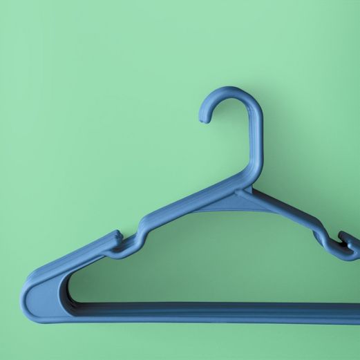 stack of blue clothing hangers