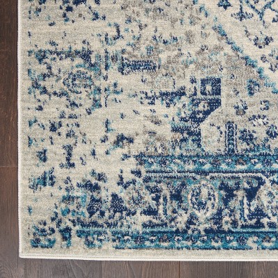 Ivory and Light Blue Synthetic 6' x 9' Easy Care Rug