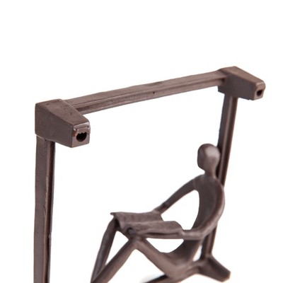 Dark Brown Iron Man Reading on Window Sill Sculpture