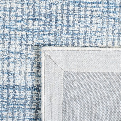 Ivory and Blue Hand-Tufted Wool 4' x 6' Area Rug