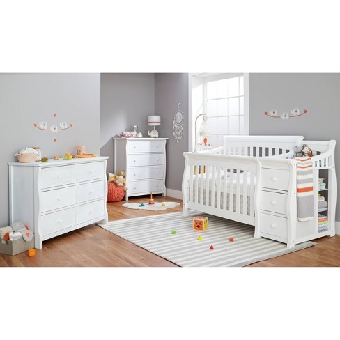 White crib with store attached changing table