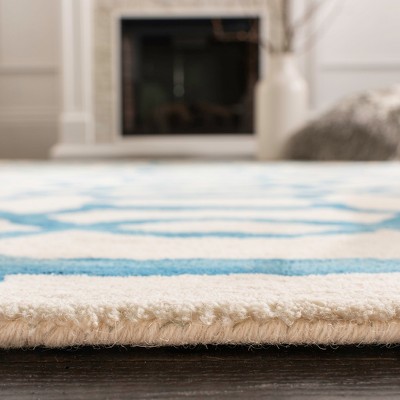 Ivory and Turquoise Hand-Tufted Wool 4' x 6' Area Rug