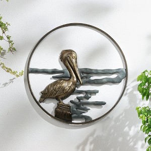 SPI Home Pelican Wall Art – 22" Coastal Bird Metal Sculpture, Bronze Finish Round Nautical Wall Accent for Indoor or Outdoor Display - 1 of 3