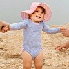 RuffleButts Seersucker Long Sleeve Rash Guard One Piece & Hat Set - 3 of 4