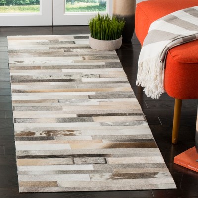 Handmade Geometric Gray Cowhide Accent Rug - 27" x 7"