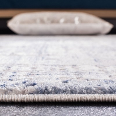 Ivory and Blue Hand-Knotted Round Synthetic Area Rug