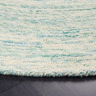 Handmade Ivory and Blue Round Wool Area Rug, 4' Diameter